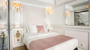 
a hotel room with a large bed and a large mirror at Luxury 4 bedroom 3 bathroom Aristocratic apartment - Louvre in Paris
