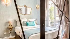 a bedroom with a bed and a window at Luxury 4 bedroom 3 bathroom Aristocratic apartment - Louvre in Paris