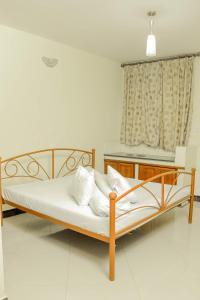 Krevet ili kreveti u jedinici u okviru objekta Maresi Luxury Hotel