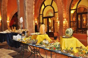 a table with plates of food on it in a room at ONATTI Beach Resort - Marsa Alam in Quseir