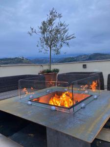 a table with a fire pit on top of it at Dimora de Matera Luxury Suites in Cosenza