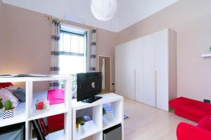 a living room with a white cabinet and a television at Core de Lecce - Lecce Selection in Lecce