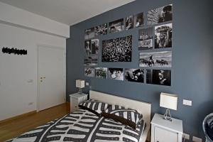 A bed or beds in a room at The Photos Room B&B