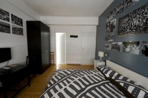 A bed or beds in a room at The Photos Room B&B