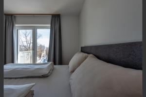Postel nebo postele na pokoji v ubytování Ski & Nature Apartment