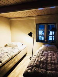 Posteľ alebo postele v izbe v ubytovaní Sivagerhuset Holiday-Home