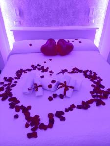 a bed with a heart made out of hearts at Il Mare di Roma Deluxe in Lido di Ostia