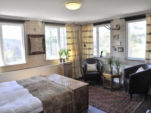Katil atau katil-katil dalam bilik di Kolmårdsgården B&B