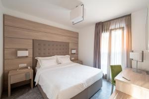 Postel nebo postele na pokoji v ubytování HOTEL TRILAGO