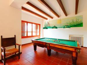 a room with a pool table and a chair at Villa Sant'Albino by Interhome in Sorrezzana