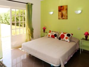 a bedroom with a bed and a window at Holiday Home Da Bela Vista - PAD110 by Interhome in Paderne