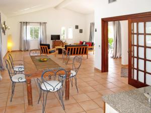 a kitchen and living room with a table and chairs at Holiday Home Monte Quercus by Interhome in Porches +15 photos