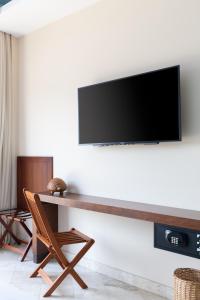 TV a/nebo společenská místnost v ubytování Biwa Tulum