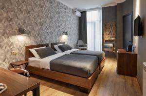 Postel nebo postele na pokoji v ubytování Hotel City