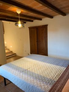A bed or beds in a room at Terrazza sul Tufo