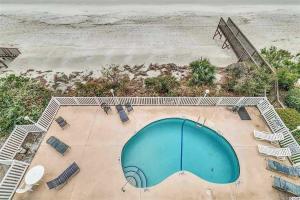 an overhead view of a swimming pool next to the beach at On-The-Beach Escape Oceanfront in Surfside! in Myrtle Beach
