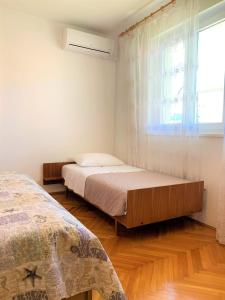 Postel nebo postele na pokoji v ubytování Roko apartment house