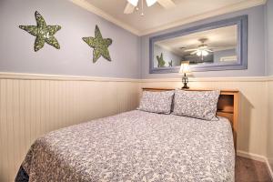a bedroom with a bed and two stars on the wall at Beach View, Pool and Tennis Hilton Head Island Unit in Hilton Head Island +27 photos