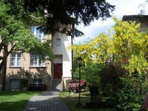 a house with a brick walkway in front of it at Willa Jasna in Czorsztyn
