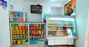 a refrigerator filled with lots of food and drinks at Hotel Emperador in Barbosa