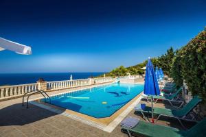 a swimming pool with a view of the ocean at Keri Me Away - Argo's Summer Poolside Retreats in Keri