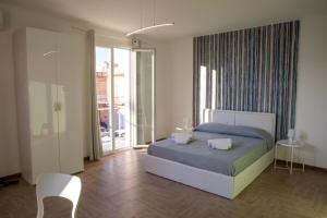 Postel nebo postele na pokoji v ubytování Largo Sicilia B&B