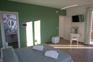 Postel nebo postele na pokoji v ubytování Largo Sicilia B&B
