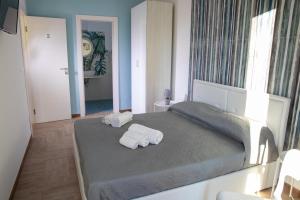 Postel nebo postele na pokoji v ubytování Largo Sicilia B&B