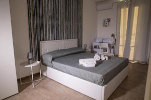 Postel nebo postele na pokoji v ubytování Largo Sicilia B&B