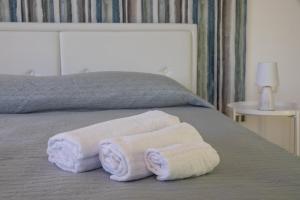 Postel nebo postele na pokoji v ubytování Largo Sicilia B&B
