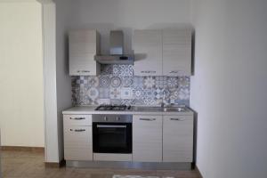 Kuchyň nebo kuchyňský kout v ubytování Largo Sicilia B&B