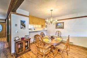 a kitchen and dining room with a table and chairs at Quiet Home with Graeagle Meadows Golf Course View! in Graeagle