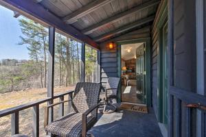 a porch of a house with chairs on it at Secluded Ridgetop Hideaway with Valley Views! in Menlo