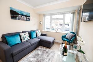 a living room with a couch and a glass table at Central Windsor Stunning 4 Bedroom Spacious Modern House in Windsor