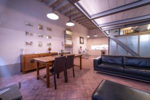 a living room with a table and a couch at BRIXIA LUXORY & LOFT in Brescia