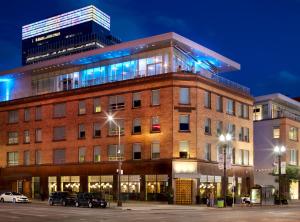 a building with cars parked in front of it at The Chambers Hotel in Minneapolis