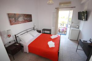 Postel nebo postele na pokoji v ubytování Cyclades Beach