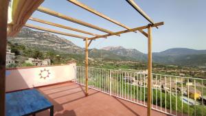 a balcony with a view of mountains at Casa Sisco, dins de la Vall d'Àger in Ager