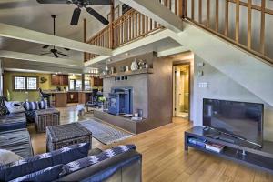 a large living room with a large television and a living room at Dog-Friendly Cabin Near Tonto National Forest! in Payson