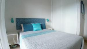 A bed or beds in a room at Apartamento Pardela