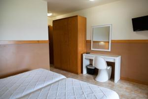 Postel nebo postele na pokoji v ubytování Hotel Ría de Suances