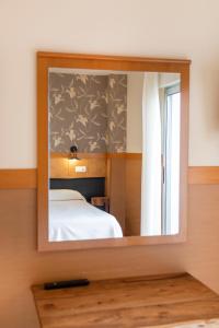 Postel nebo postele na pokoji v ubytování Hotel Ría de Suances