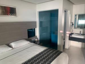 Postel nebo postele na pokoji v ubytování Motel Pedregal