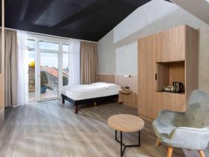 Postel nebo postele na pokoji v ubytování ibis Styles Dresden Neustadt