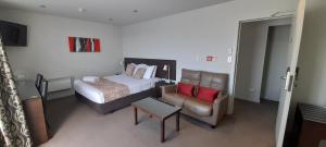 Voodi või voodid majutusasutuse Dunedin Palms Motel toas