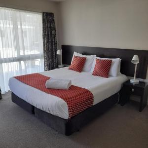 Voodi või voodid majutusasutuse Dunedin Palms Motel toas