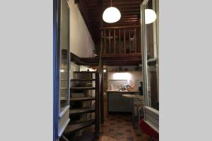 a small room with a kitchen and a loft at Studio Lyon 1er in Lyon +8 photos