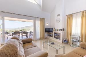 a living room with a couch and a table at La Manga Club Resort - Los Olivos 32 in Atamaría