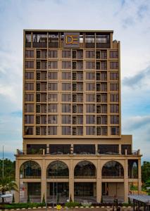 a large building with a sign on top of it at D ELEGANCE GRAND BANDAR SERI ALAM in Masai