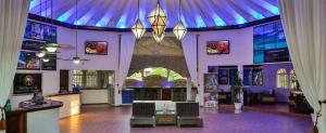 a large building with a blue ceiling and a lobby at Junior Suite in Puerto Plata at Lifestyle Holidays Vacation Club in San Felipe de Puerto Plata